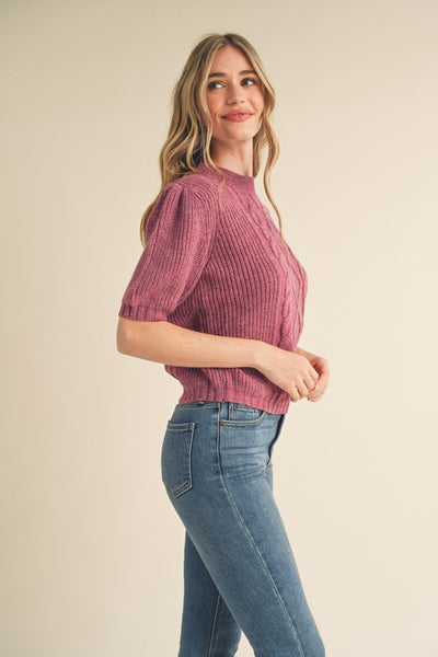 Say hello to your new favorite sweater! With its soft cable knit, puff sleeves, and ribbed cuffs and hem, this cozy plum sweater will add warmth and style to your wardrobe. Throw it on and you're ready for anything! Product Details: 100% Polyester Cable knit puff sleeve sweater Round neckline Short puff sleeves with ribbed cuffs Gathered puff shoulders Ribbed neckline, cuffs, and hem Cable knit mixed with ribbed knit bodice Semi-fitted bodice