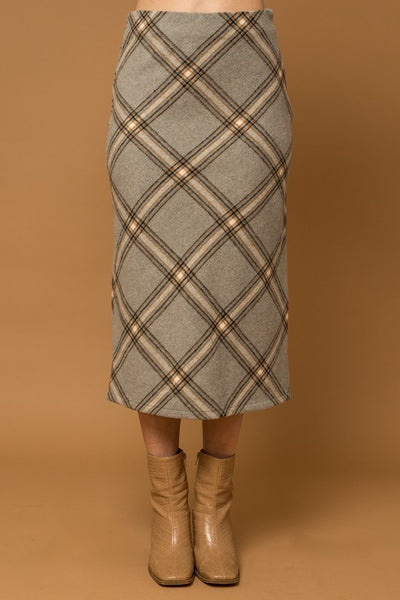 The Penny Plaid Skirt is a truly timeless piece – crafted with a unique grey plaid design and bias cut, it offers an elegant, yet versatile appearance that adds sophisticated depth to any wardrobe. Its midi length complements a variety of styles for effortless look.