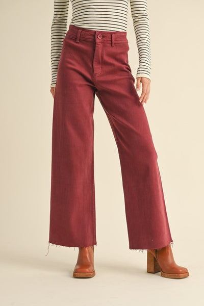 Elevate your style game with our Maroon Straight Wide Leg Pants. Featuring a high waist and frayed hem, these pants offer both a flattering fit and ultimate comfort. Made from a blend of cotton and spandex, they are perfect for any occasion. 