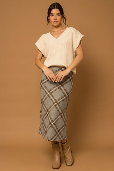 Our classic V-Neck Power Shoulder Sweater Vest is ready to take you from day to night. Crafted with soft knit fabric, this timeless ivory top is a perfect layering piece over your favorite button-down shirt with jeans or mini dress for an effortless, timeless style. Ready to be taken anywhere, this vest gives you the power to make a statement. Product Details: 50% Acrylic, 50% Polyester Ribbed V-neck