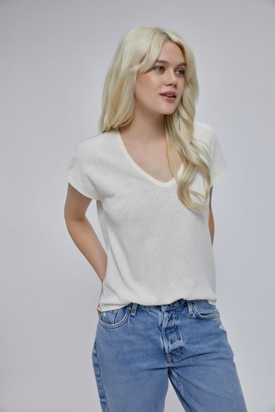 Who doesn't love a white tee! I know I always have one (or 10) in my closet! This classic white short sleeve t-shirt features a v-neckline and short cap sleeves. Product Details: 64% Rayon, 34% Polyester Raw edge stitch detailing V-neckline Cap sleeves Back yoke