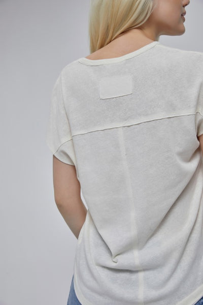 Who doesn't love a white tee! I know I always have one (or 10) in my closet! This classic white short sleeve t-shirt features a v-neckline and short cap sleeves. Product Details: 64% Rayon, 34% Polyester Raw edge stitch detailing V-neckline Cap sleeves Back yoke