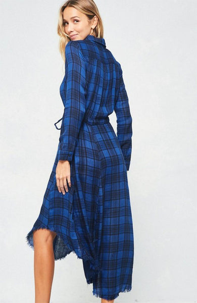 A blue and black plaid pattern shirt dress featuring basic collar, button front, self-tie waist, long sleeves and hi-lo hem. This dress is made with medium weight fabric that has very beautiful patterns.
