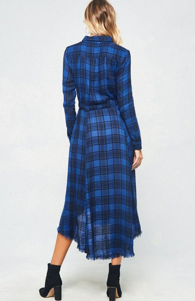 A blue and black plaid pattern shirt dress featuring basic collar, button front, self-tie waist, long sleeves and hi-lo hem. This dress is made with medium weight fabric that has very beautiful patterns.