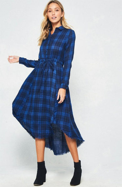 A blue and black plaid pattern shirt dress featuring basic collar, button front, self-tie waist, long sleeves and hi-lo hem. This dress is made with medium weight fabric that has very beautiful patterns.