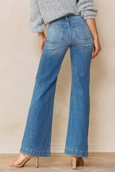 An easy, free-spirited style describes these slim wide leg jeans. Featuring a high rise and wide bottom hem. The medium vintage wash pairs well with all shades and wear over boots, flats or whatever! Product Details: Leg opening: 22" Front Rise: 10 1/2" Inseam: 33" Knee: 18 1/2" Bottom Hem: 1 1/2" 99% Cotton, 1% Spandex Five pockets Zipper fly with button closure High rise