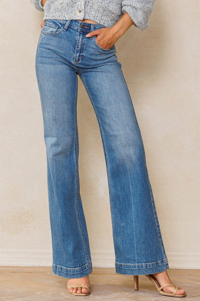 An easy, free-spirited style describes these slim wide leg jeans. Featuring a high rise and wide bottom hem. The medium vintage wash pairs well with all shades and wear over boots, flats or whatever! Product Details: Leg opening: 22" Front Rise: 10 1/2" Inseam: 33" Knee: 18 1/2" Bottom Hem: 1 1/2" 99% Cotton, 1% Spandex Five pockets Zipper fly with button closure High rise