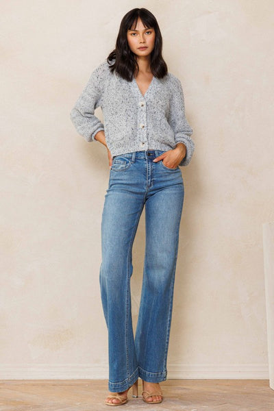 An easy, free-spirited style describes these slim wide leg jeans. Featuring a high rise and wide bottom hem. The medium vintage wash pairs well with all shades and wear over boots, flats or whatever! Product Details: Leg opening: 22" Front Rise: 10 1/2" Inseam: 33" Knee: 18 1/2" Bottom Hem: 1 1/2" 99% Cotton, 1% Spandex Five pockets Zipper fly with button closure High rise
