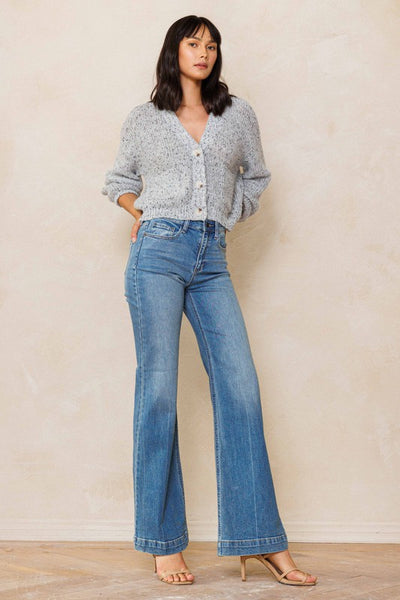 An easy, free-spirited style describes these slim wide leg jeans. Featuring a high rise and wide bottom hem. The medium vintage wash pairs well with all shades and wear over boots, flats or whatever! Product Details: Leg opening: 22" Front Rise: 10 1/2" Inseam: 33" Knee: 18 1/2" Bottom Hem: 1 1/2" 99% Cotton, 1% Spandex Five pockets Zipper fly with button closure High rise