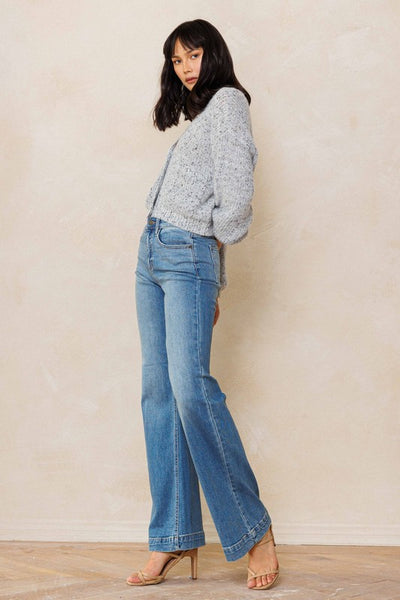 An easy, free-spirited style describes these slim wide leg jeans. Featuring a high rise and wide bottom hem. The medium vintage wash pairs well with all shades and wear over boots, flats or whatever! Product Details: Leg opening: 22" Front Rise: 10 1/2" Inseam: 33" Knee: 18 1/2" Bottom Hem: 1 1/2" 99% Cotton, 1% Spandex Five pockets Zipper fly with button closure High rise