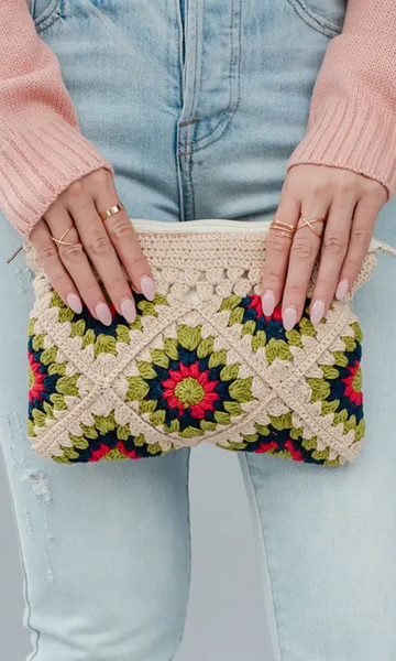 This on trend beige and multicolored crochet clutch is a must have! Featuring a beige lime green, navy and pink color palette. It's the perfect summer accessory! Product Details: Zip closure Fully lined Measures 9.5" x 7" x 1" 100% Cotton