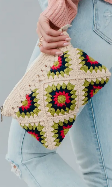 This on trend beige and multicolored crochet clutch is a must have! Featuring a beige lime green, navy and pink color palette. It's the perfect summer accessory! Product Details: Zip closure Fully lined Measures 9.5" x 7" x 1" 100% Cotton