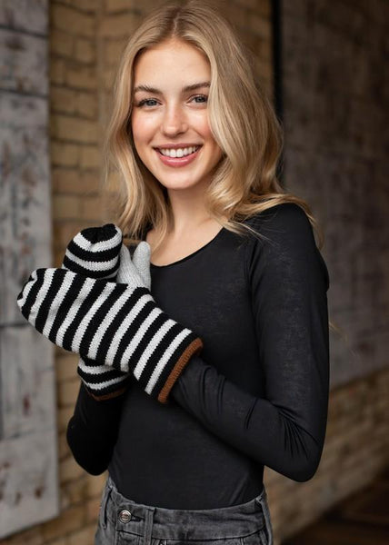 Keep your hands warm this winter with these grey and black striped fleeced lined mittens. The perfect color combo to pair perfectly with all your winter coats. Product Details: Fleece lined