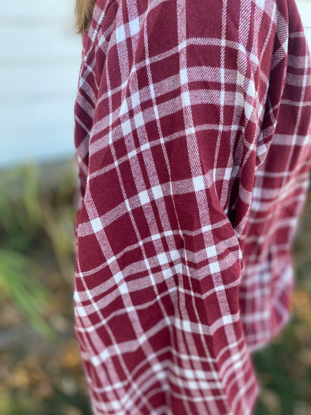 Chic burgundy and white plaid top that screams cooler weather look! Super flattering collarless, split neck style with balloon sleeves. Product Details: 60% Polyester, 30% Cotton, 10% Viscose Billowing sleeves Long sleeve Button front