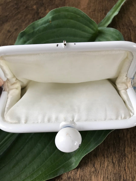 Lovely beaded vintage coin purse, with blue and clear beads and clasp closure. Approximately 6.5" wide x 4.25" high.