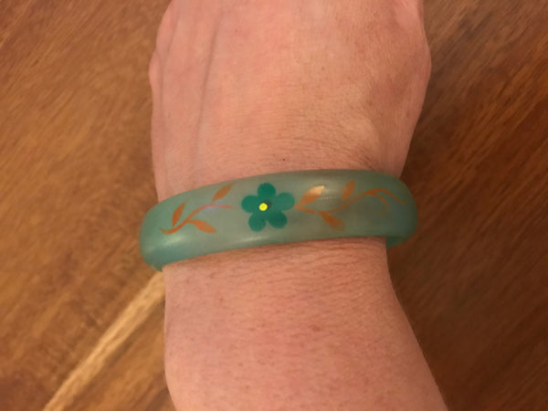 Gorgeous vintage lucite painted bangle bracelet. Width of bracelet is approximately 2 3/4".