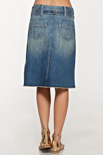 Button down front jean skirt that is the perfect length. Love the front pockets and cute button detail down the front of the skirt. Raw hem and button detail on the back. This jean skirt is amazing quality and that extra special piece that will become your go to stable.