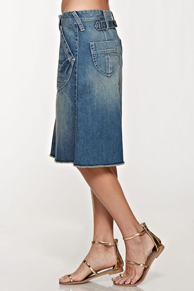 Button down front jean skirt that is the perfect length. Love the front pockets and cute button detail down the front of the skirt. Raw hem and button detail on the back. This jean skirt is amazing quality and that extra special piece that will become your go to stable.
