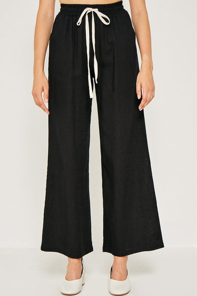 Flowy linen tie-front wide leg pants perfect for warmer weather. For an effortless look pair with a simple tank or 3/4 sleeve tie top to transition into Fall. Breathable Linen Blend Contrast Drawstring Waist Wide Leg Silhouette Side Pockets Unlined Measurements: Size Waist Inseam Small 12.5" 30" Medium 13.5" 30.5" Large 14.5" 31" These measurements reflect the garment laying flat. Material & Care: 70% Viscose 30% Linen Hand Wash Cold Hang Dry