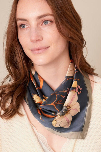 Stunning silky navy floral scarf. So many options of how to wear this scarf - around your neck as a bandana in your hair as a ponytail holder around your waist as a belt Product Details: Approximately 27.5" x 27.5" 100% Polyester