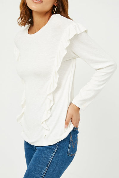 A twist on the classic white top! A ruffled drop shoulder and marled ribbed knit provides the right amount of stretch. Pair with our October Olive Joggers or your favorite pair of jeans for an instant outfit you'll love! Product Details: 99% Rayon, 5% Spandex Off white Knit fabric Ruffle details Rounded neckline Care - hand wash cold