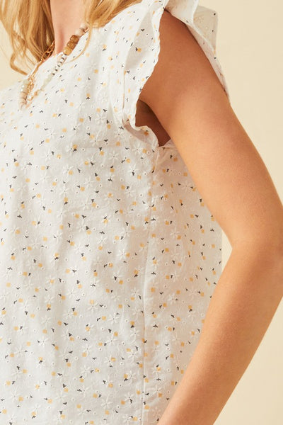 This ivory ditsy print eyelet top is so sweet. Featuring a luxe eyelet design that is oh-so feminine. With ruffle short sleeve design and back keyhole closure. Pair with your favorite jeans for an effortless warmer weather look. Product Details: 100% cotton Lined Ditsy woven fabric Round cut neckline Back keyhole closure