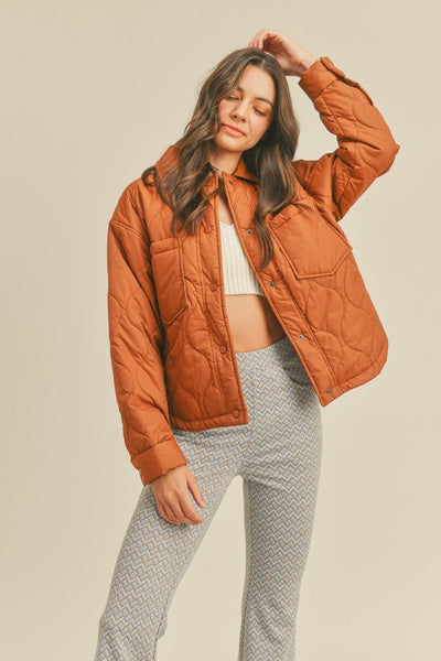 This roasted pecan quilted puffer jacket screams Fall! A perfect transitional piece featuring a boxy fit along with front patch pockets and snap front closure. An absolute essential this season! Product Features: 100% Nylon Lined Front patch pockets Snap button closure Long sleeves with snap button cuffs Shirttail hem Model is 5' 9" 32-24.5-34.5 and wearing a small