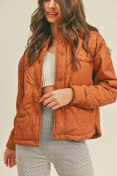 This roasted pecan quilted puffer jacket screams Fall! A perfect transitional piece featuring a boxy fit along with front patch pockets and snap front closure. An absolute essential this season! Product Features: 100% Nylon Lined Front patch pockets Snap button closure Long sleeves with snap button cuffs Shirttail hem Model is 5' 9" 32-24.5-34.5 and wearing a small