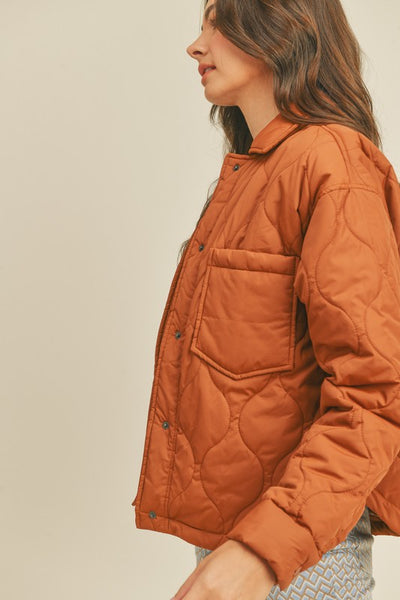 This roasted pecan quilted puffer jacket screams Fall! A perfect transitional piece featuring a boxy fit along with front patch pockets and snap front closure. An absolute essential this season! Product Features: 100% Nylon Lined Front patch pockets Snap button closure Long sleeves with snap button cuffs Shirttail hem Model is 5' 9" 32-24.5-34.5 and wearing a small