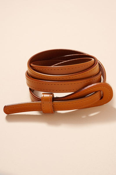 This go to camel tie belt can be accessorized with so many outfits. The thin style design is super flattering. Product Details: Approximately 45" in length Approximately 0.55" wide 100% Genuine leather One size