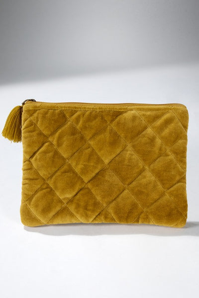 How cute is this quilted pouch! The cotton velvet material gives it a luxurious feel that you'll never want to put it down. With fun details including metallic stitching and tassel accent. Product Details: Shell 100% cotton and trim 100% acrylic Approximate length - 6.5" and width - 9" Zipper closure Comes in a mustard and gray color