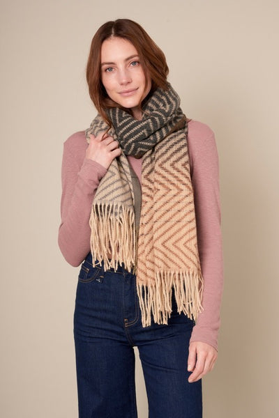 This beautiful chevron oblong scarf will set you apart in a crowd! With a gradient color palette of blacks, greys and browns. Product Details: Approximately 27.5" wide and 71" long 100% Polyester