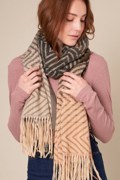 This beautiful chevron oblong scarf will set you apart in a crowd! With a gradient color palette of blacks, greys and browns. Product Details: Approximately 27.5" wide and 71" long 100% Polyester