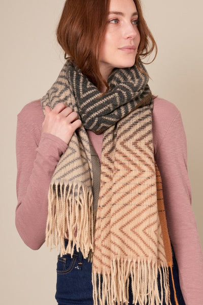 This beautiful chevron oblong scarf will set you apart in a crowd! With a gradient color palette of blacks, greys and browns. Product Details: Approximately 27.5" wide and 71" long 100% Polyester