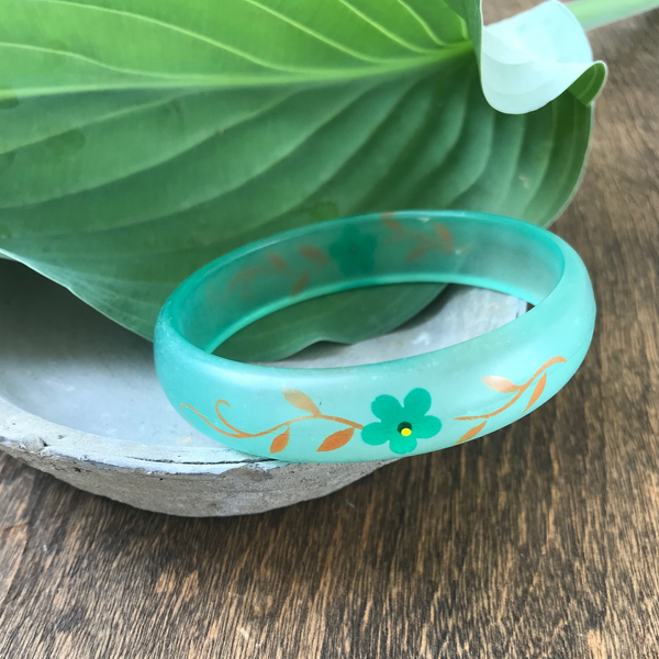 Gorgeous vintage lucite painted bangle bracelet. Width of bracelet is approximately 2 3/4".