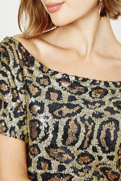 WOW - that's what you'll hear wearing this stunning top. The leopard print sequin is fabulous plus the off the shoulder neckline is a perfect fit. This top looks great with a skirt or with a pair of your favorite jeans. It will add a bit of fun and sparkle to your outfit.