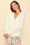 Wrap up in the world's coziest cardigan! Just Jewels Button Cardigan will keep you warm and stylish with its cream v-neck and beautiful jewel buttons. Add a touch of glamour and elegance while cozying up in the ultimate cardigan! Pairs perfectly with our Fall Floral Pants!