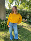 Achieve effortless style in the Easy Like Sunday Morning mustard pullover. This timeless sweater is crafted from a ribbed knit and looks great in any season. Its slouchy, cropped fit features a round neckline and defined seaming, while slightly exaggerated sleeves add subtle shape. Get ready to look cool and classic, whatever the day may bring!  Product Details:  Slouchy, cropped fit Ribbed knit