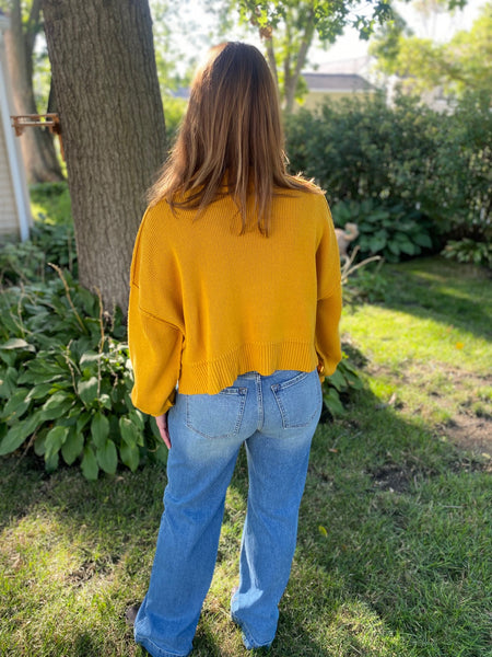 Achieve effortless style in the Easy Like Sunday Morning mustard pullover. This timeless sweater is crafted from a ribbed knit and looks great in any season. Its slouchy, cropped fit features a round neckline and defined seaming, while slightly exaggerated sleeves add subtle shape. Get ready to look cool and classic, whatever the day may bring!  Product Details:  Slouchy, cropped fit Ribbed knit