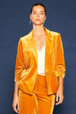 This Very Velvet Blazer's luxurious mustard plush velvet is sure to exude an air of elegance. Featuring an open front, notched lapels, and ruched three-quarter sleeves, this timeless piece is the perfect way to add a touch of sophistication to any outfit.  Product Details:  90% polyester and 10% spandex Looser fit, consider sizing down