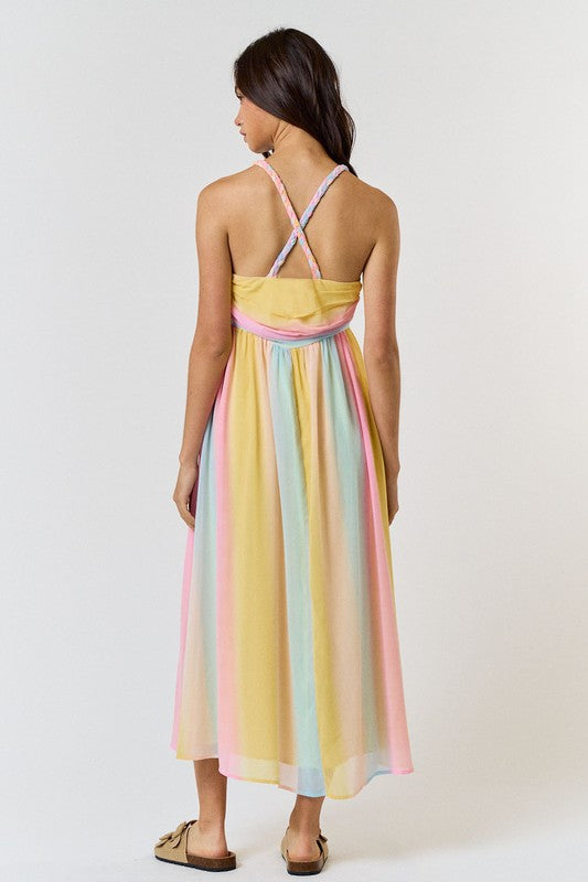 <p data-mce-fragment="1">Express your playful side with our Rainbow Maxi Dress. This dress features pastel stripes and a braided halter design, perfect for a fun and stylish look. Embrace the vibrant colors and make a statement wherever you go.</p> <p data-mce-fragment="1">Product Features:</p> <ul> <li>100% Polyester</li> <li>Lined</li> </ul>
