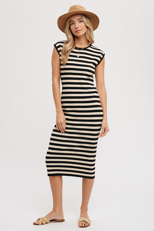 Our Striped Tank Midi Dress is the must have dress of the summer! This chic dress features a unique blend of contrasting stripe patterns in bold, complementary black and cream colors. The sleeveless tank-style top creates a vibrant yet sophisticated look, while the elegant midi length makes it perfect for any occasion. .  Product Features:  41% Acrylic, 37% Cotton, 22% Nylon Sleeveless Midi length