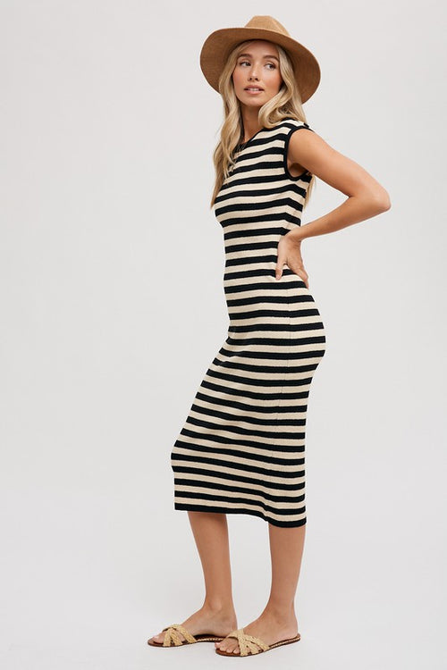 Our Striped Tank Midi Dress is the must have dress of the summer! This chic dress features a unique blend of contrasting stripe patterns in bold, complementary black and cream colors. The sleeveless tank-style top creates a vibrant yet sophisticated look, while the elegant midi length makes it perfect for any occasion. .  Product Features:  41% Acrylic, 37% Cotton, 22% Nylon Sleeveless Midi length