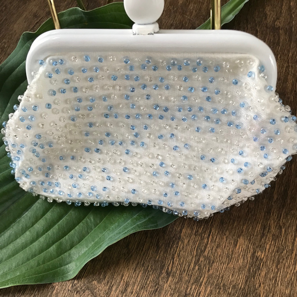 Lovely beaded vintage coin purse, with blue and clear beads and clasp closure. Approximately 6.5" wide x 4.25" high. 