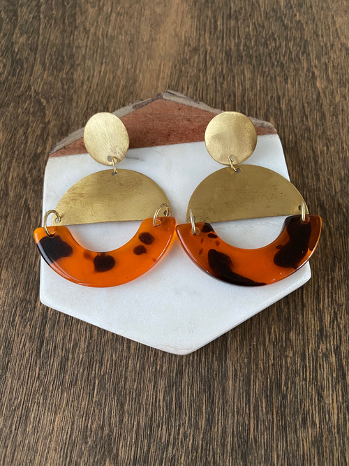 Add these classic, unique earrings to your wardrobe for instant polish! The combination of acrylic tortoise and half moon shaped brass is stunning. 