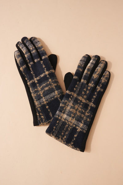 Stay warm and stylish at the same time with these classic black and tan plaid gloves.  Product Details:  100% Polyester Approximately 3.65" wide One size fits most Smart touch screen gloves