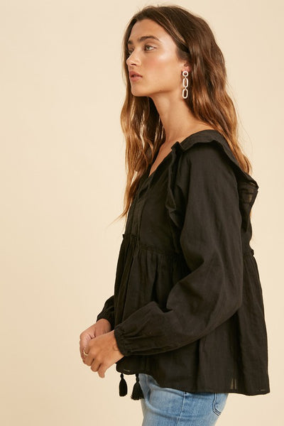 You'll definitely want to add this gorgeous black peasant blouse to your closet! Fun details include - shoulder ruffle details, insert lace and tassel ties.   Product Details:  100% Rayon Lace: 100% Cotton Elasticated wrists