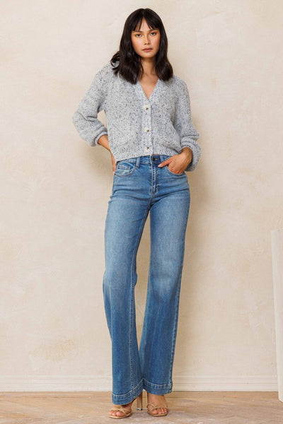 An easy, free-spirited style describes these slim wide leg jeans. Featuring a high rise and wide bottom hem. The medium vintage wash pairs well with all shades and wear over boots, flats or whatever!    Product Details:  Leg opening: 22" Front Rise: 10 1/2" Inseam: 33" Knee: 18 1/2" Bottom Hem: 1 1/2" 99% Cotton, 1% Spandex Five pockets Zipper fly with button closure High rise