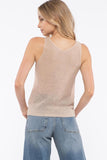 Add texture to your outfit with this beige cable knit sweater cami. Perfect for a chic or cozy look. Pair with a blazer to dress it up or a flannel to go more causal.  Product Details:  100% Acrylic Semi-fitted Sleeveless V Neckline Beige cable knit fabric