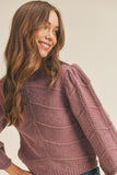 How cute is this mauve chevron sweater. With 3/4 bell sleeves and scalloped cuffs, you'll definitely fall in love with it.   Product Details:  Fabric - 70% Acrylic, 20% Polyester, 10% Spandex Shorter cropped style  3/4 bell sleeves Scalloped cuffs Ribbed crew neckline and hem Chevron knit design Model is 5' 9